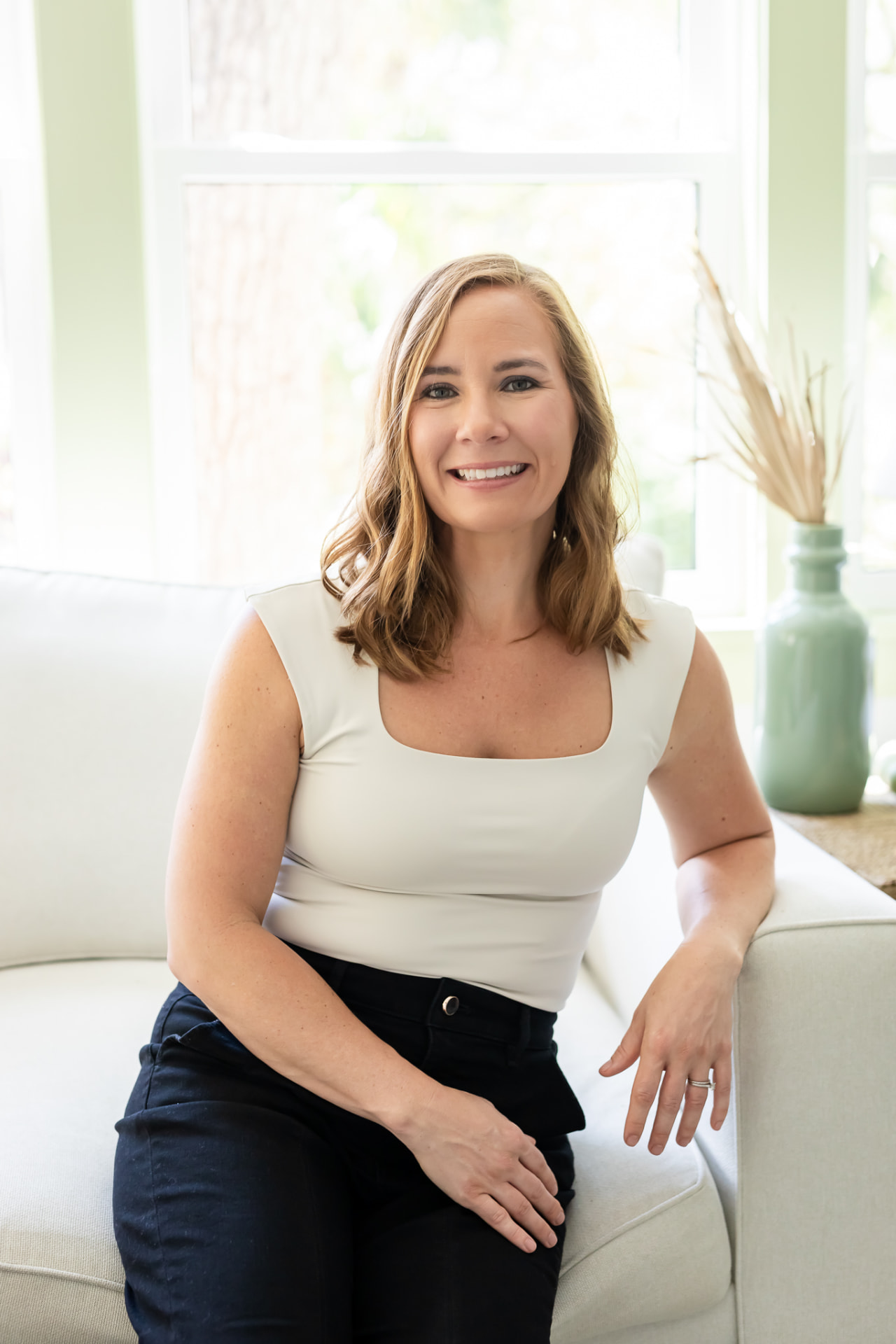 Johanna, founder of HELD, sitting in warm natural light